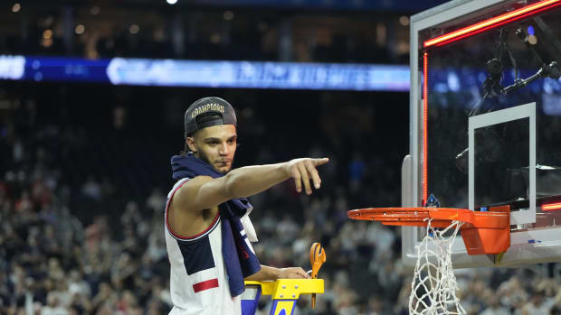 Connecticut Huskies guard Andre Jackson Jr. (44) celebrates while cutting down the net